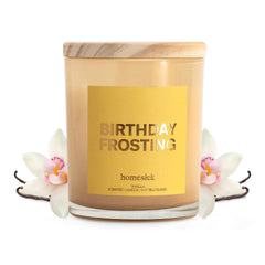 Homesick Birthday Frosting candle in a jar glows warmly for a cozy ambiance.