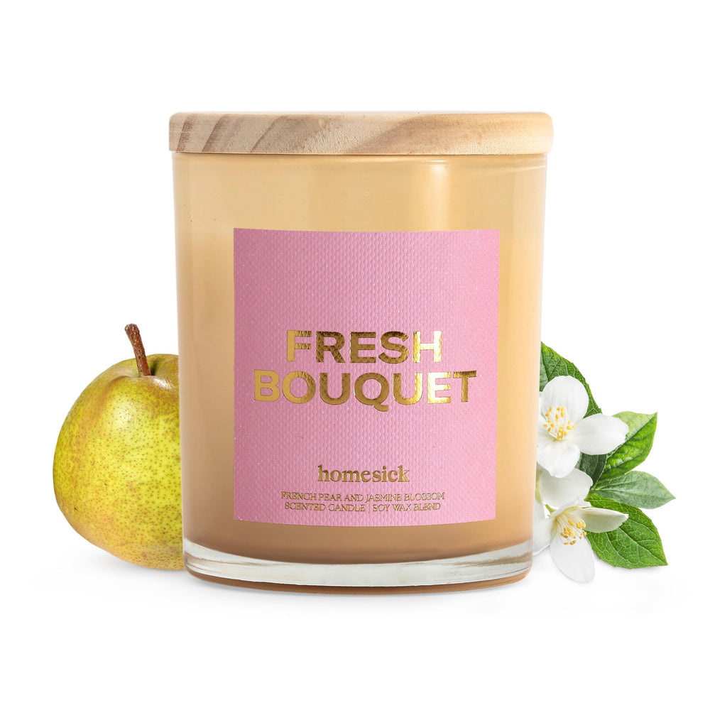Homesick Fresh Bouquet candle in a clear jar with jasmine and rose notes.