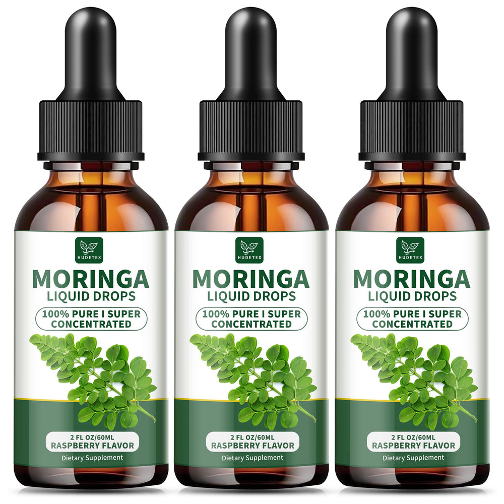 Hudetex Moringa Liquid Drops raspberry bottle on kitchen counter, supporting daily energy.