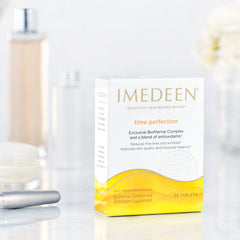 Capsules beside a glass of water illustrating convenient daily supplementation