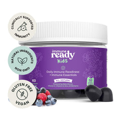 Pouring Immune Ready gummies from the mixed berry bottle for easy daily use.