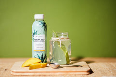 It Works! Simply Aloe Mango label emphasizes organic sourcing and natural ingredients.