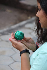 Jet International malachite sphere as a Reiki-friendly energy focus tool