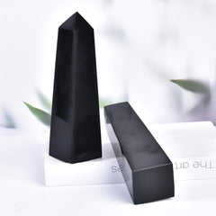 JIC Gem black obsidian wand on desk boosts workplace energy.