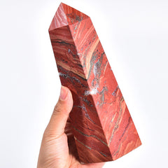 JIC Gem red Jasper crystal tower close-up showing natural color variations.