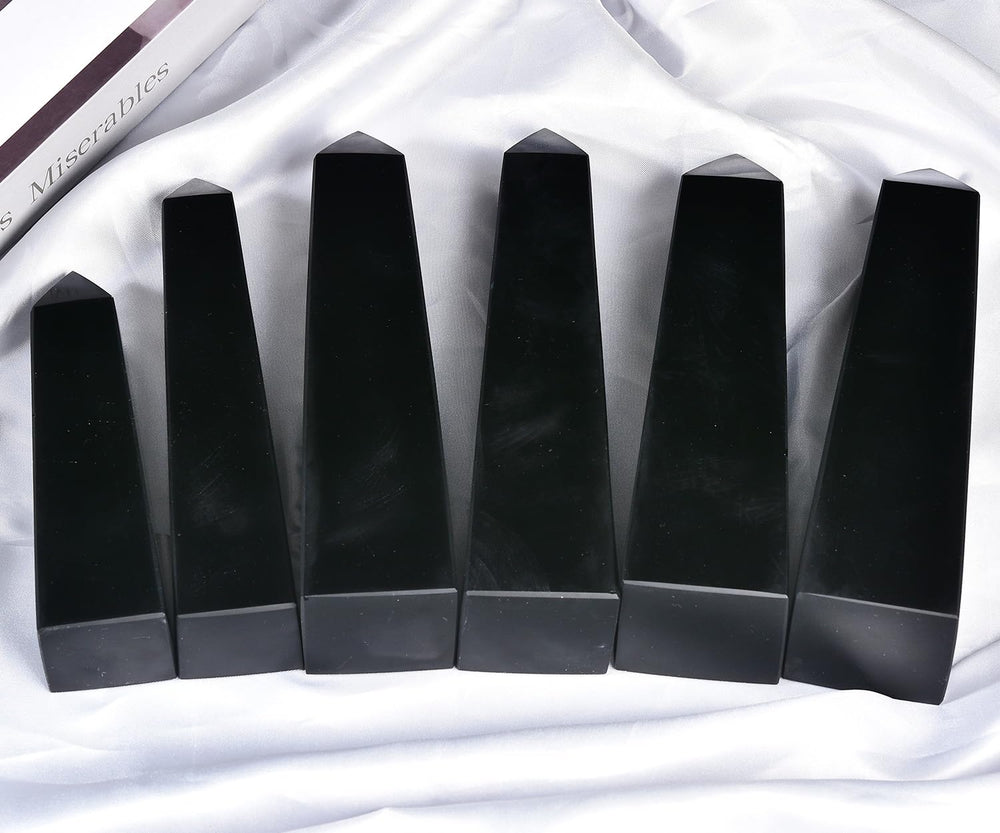 JIC Gem obsidian crystal point used for meditation and focus.
