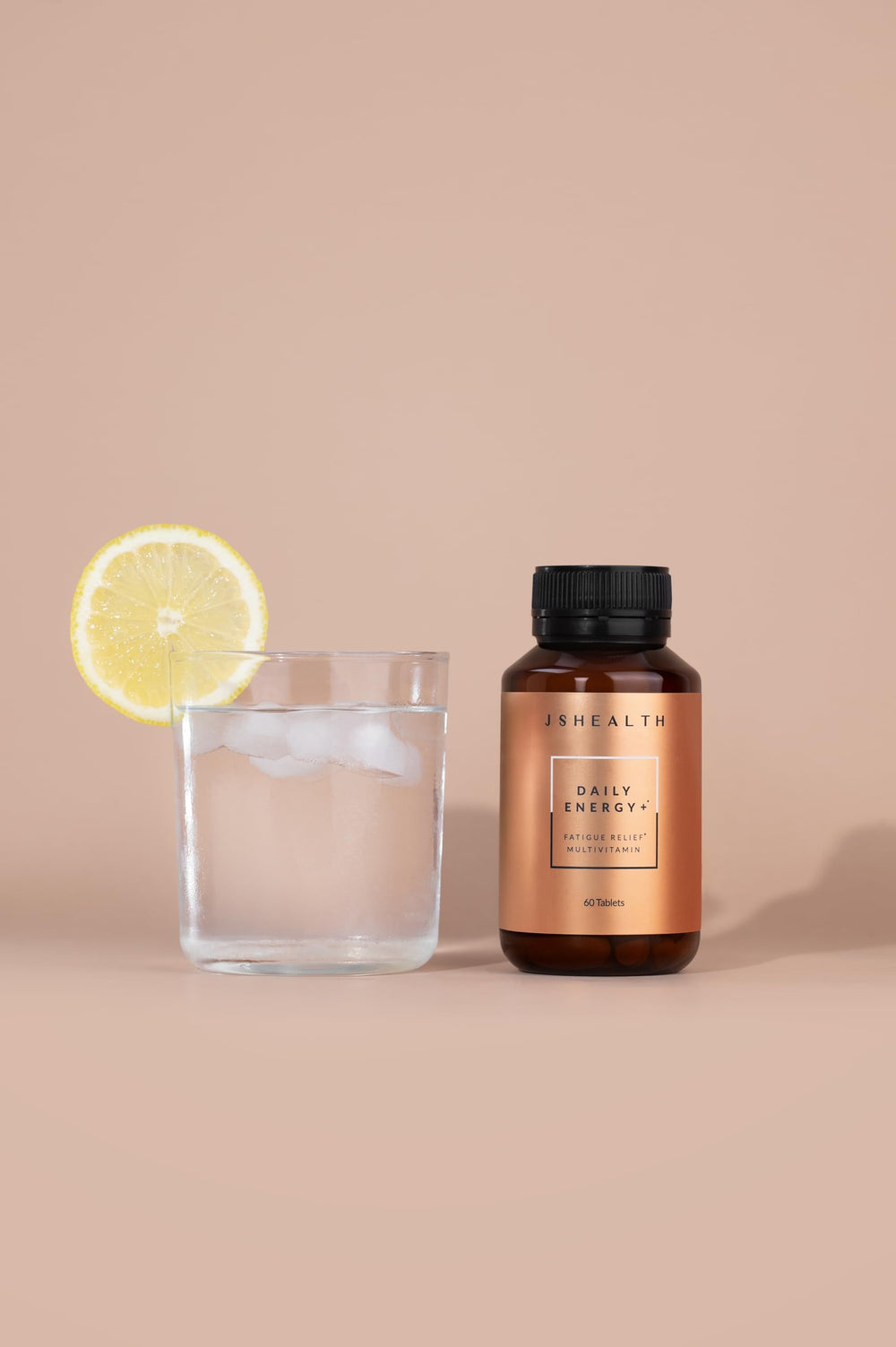 JSHealth Daily Energy bottle closeup highlights a compact vegan multivitamin for steady focus
