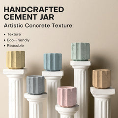 JueOne candles side detail highlights artisanal texture on cement jars.