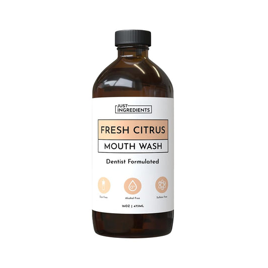 JUST INGREDIENTS Fresh Citrus Mouthwash bottle pour supports fresh breath and enamel care.