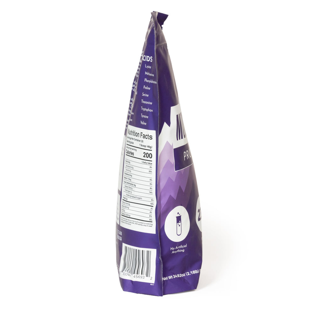 JUST INGREDIENTS Mountain Berry Protein Powder glass with shake conveys real fruit flavor