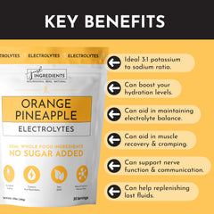 JUST INGREDIENTS Orange Pineapple Electrolytes glass served with ice for refreshing daily hydration.