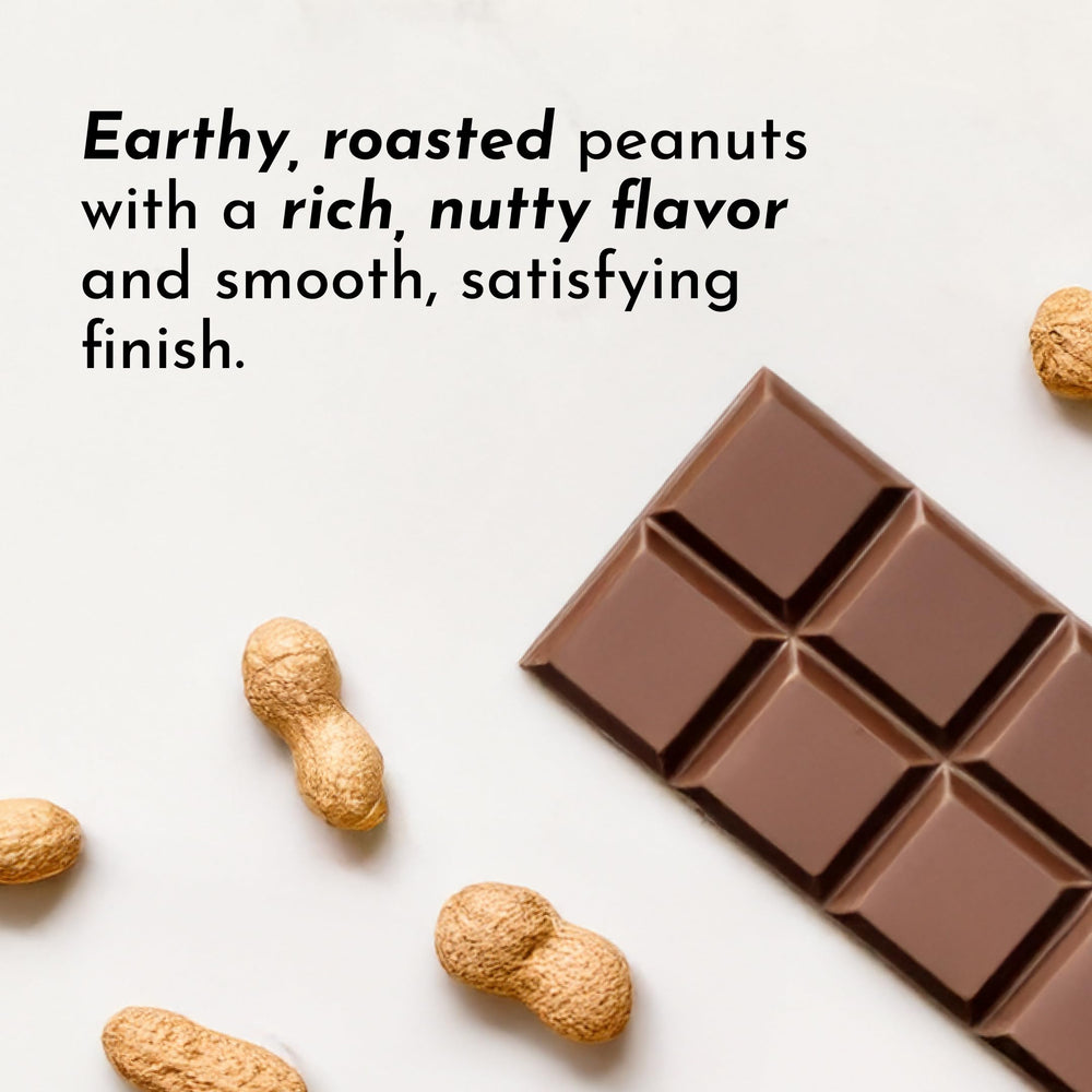Just Ingredients roasted peanut butter chocolate protein powder pour showing mix-ready texture.