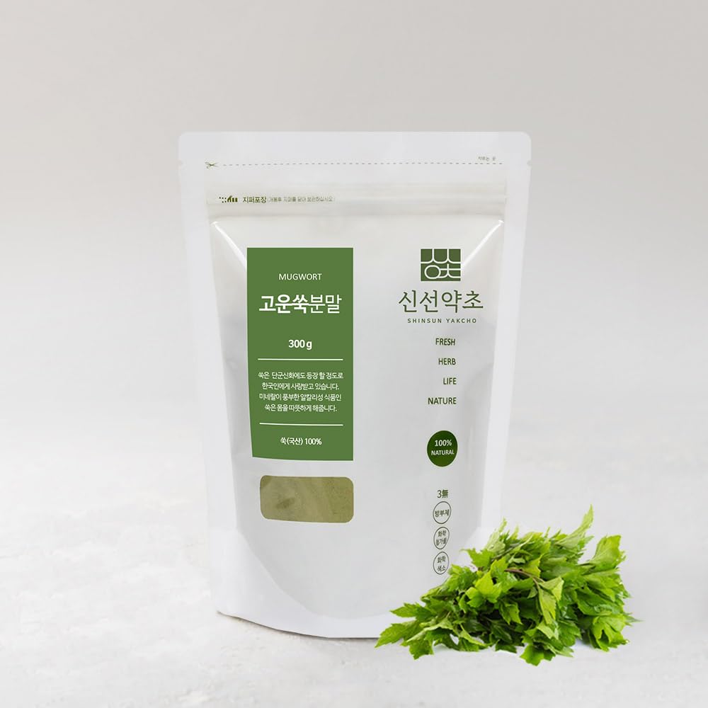 K-Herb mugwort powder on wooden spoon ready for culinary use