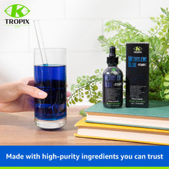 K TROPIX bottle with clear label and color shows blue-tinted solution.