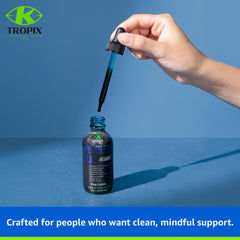 K TROPIX 2 oz bottle on countertop highlights compact, travel-friendly packaging.