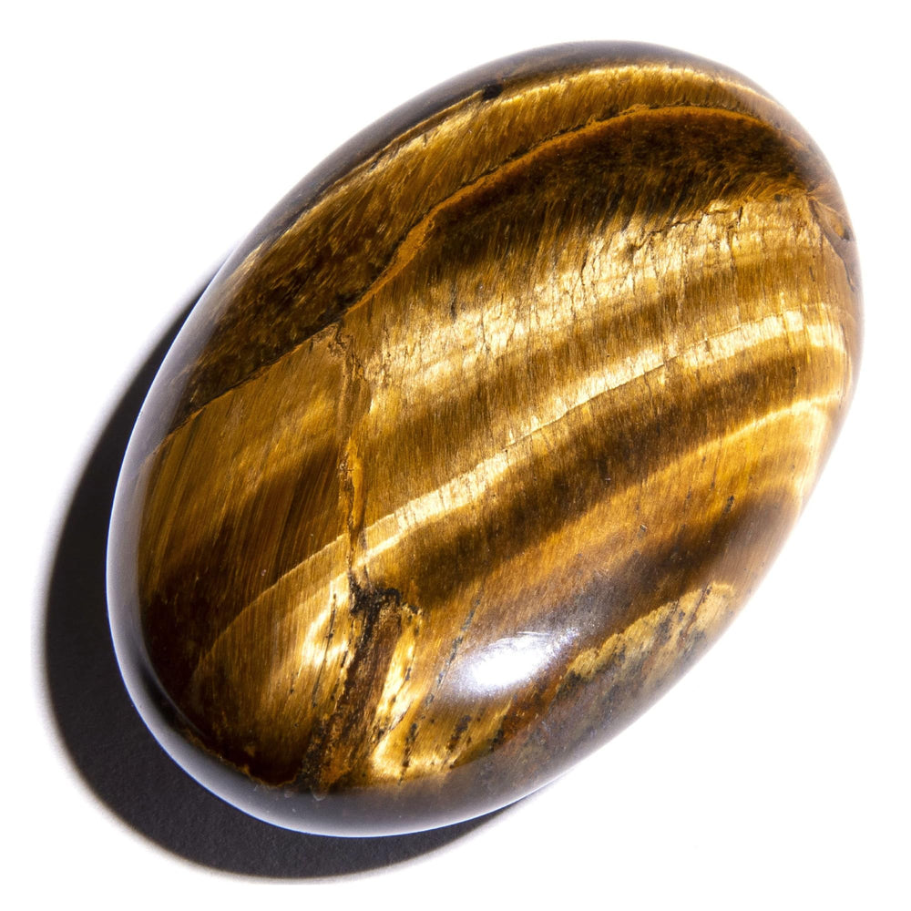 KALIFANO Tiger Eye palm stone closeup showing rich luster for energy and focus.