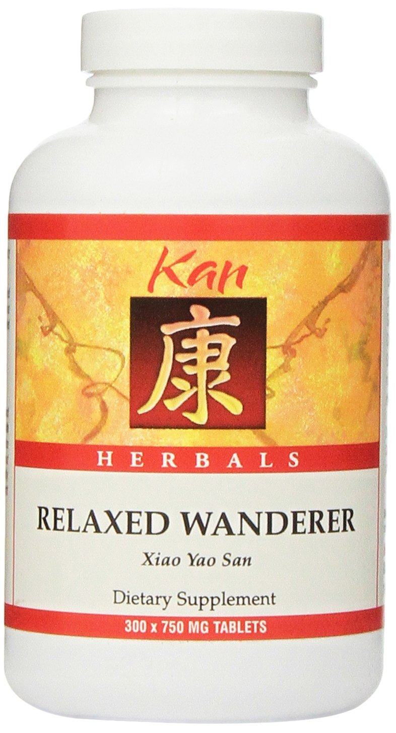 Kan Herb Relaxed Wanderer bottle pouring, a soothing herbal supplement for daily balance.