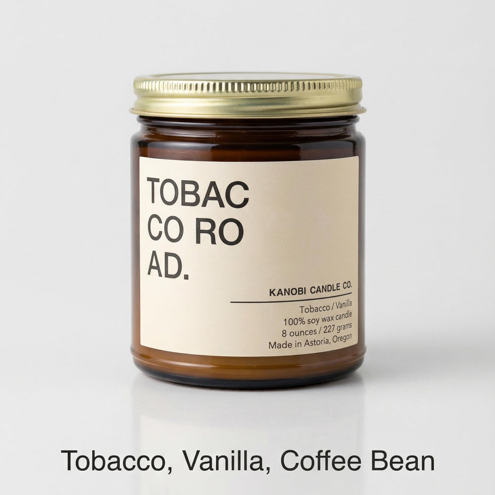 Kanobi Candle Co. Tobacco & Vanilla candle lit creating cozy ambiance