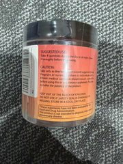Gummies poured from bottle showing easy three-per-serving use.