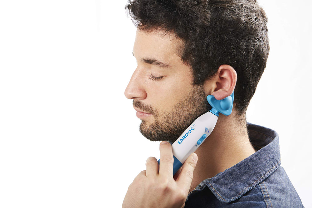 KenCap Eardoc Pro in use behind the ear with vibration technology.