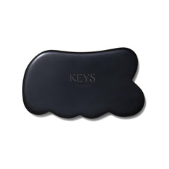 Keys Soulcare Obsidian Stone Gua Sha Tool front view for relaxing facial and body massage.