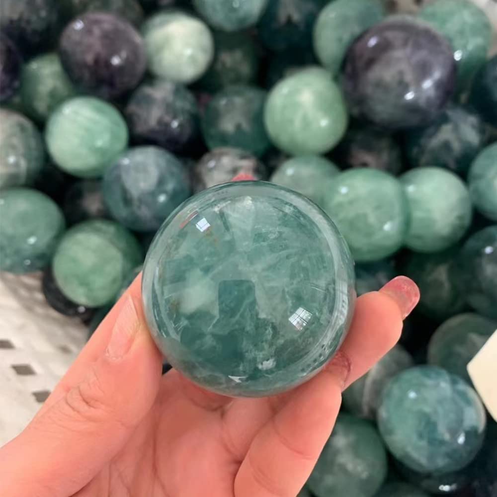 KINO green fluorite sphere with wood stand ideal for meditation sessions.