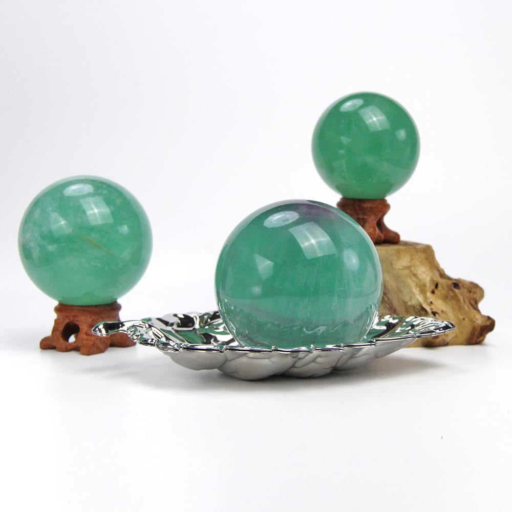 KINO green fluorite sphere close-up reveals natural color variations for study and contemplation.