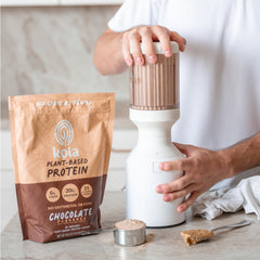 Koia chocolate protein powder shake ready, showing creamy texture for smoothies.