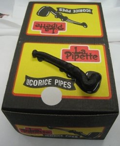 La Pipette Wockenfuss licorice pipes beside five-dozen box, ideal snack for gatherings.