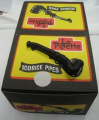 La Pipette Wockenfuss licorice pipes beside five-dozen box, ideal snack for gatherings.