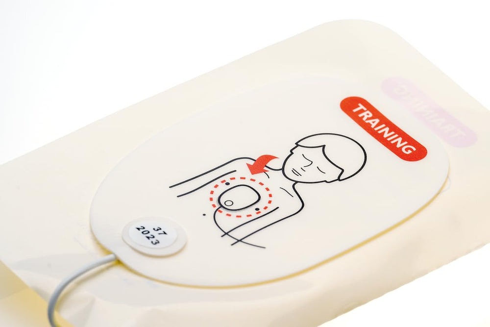 Pads in action during pediatric resuscitation training with Laerdal AED trainers.