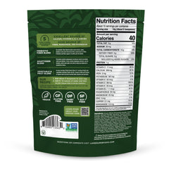 Laird Superfood Daily Greens serving scoop beside glass, highlights prebiotic fiber and vitamins.