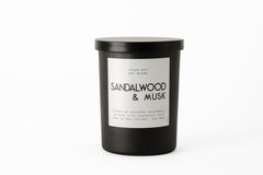 LEOBEN COMPANY Leoben Co sandalwood musk candle close-up shows cozy ambiance with natural oils
