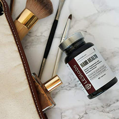 Product shown in use, suggesting a daily routine for hair and nail vitality.