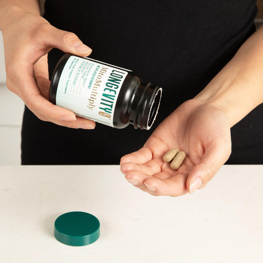 Longevity Rx MitoMultiply bottle pouring capsules for easy daily use.