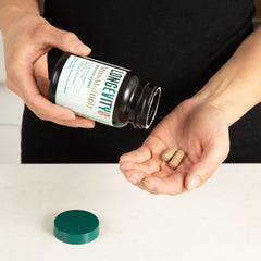Longevity Rx MitoMultiply bottle pouring capsules for easy daily use.