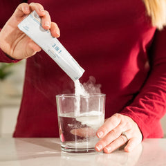 Lovie Style Daily Trifecta prepared drink in a glass with ice.