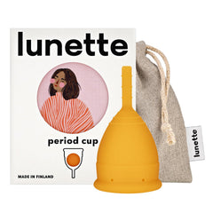 Lunette Period Cup orange packaging highlights eco-friendly design for sustainable care.