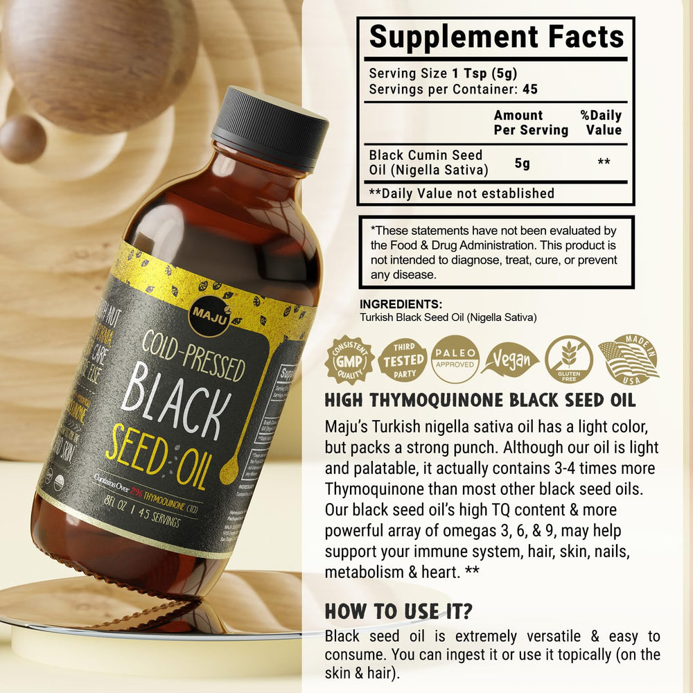 MAJU Black Seed Oil pour action shows easy dosing for everyday wellness.