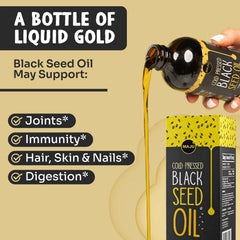 MAJU oil pour bottle demonstrates easy, measured dosing for daily use.