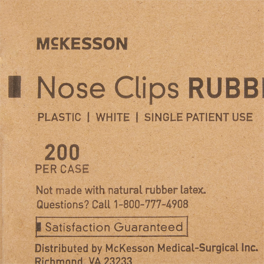 McKesson nose clips with large white pads reduce air leakage during testing.