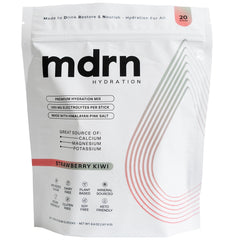 MDRN Hydration bottle pour demonstrates quick electrolyte delivery during workouts.
