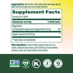 MegaFood Magnesium supplement tablet closeup highlights chelated magnesium glycinate.