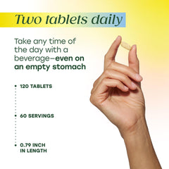 Pills in hand ready for two-tablet daily routine with MegaFood.