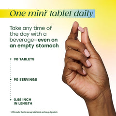 Hand holding MegaFood Methyl B12 tablet for daily routine