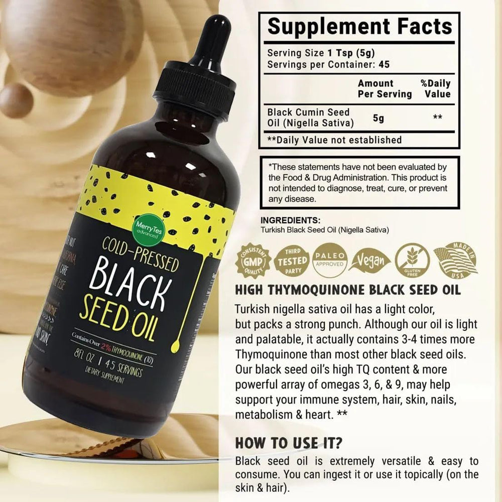 MerryTes Advanced Black Seed Oil being poured for daily wellness routine.