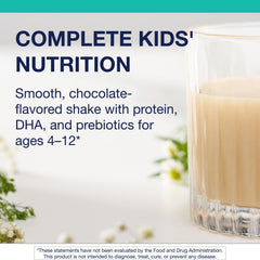 MetaKids scoop beside a glass shows easy mixing for busy mornings.