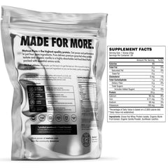 MetCon Whey Protein Isolate scoop in hand for a convenient post workout protein boost.