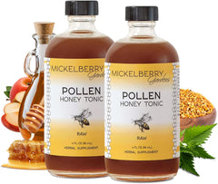 Mickelberry Gardens Pollen Honey Tonic bottle pour, a soothing herbal blend for tea or water.