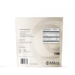 Mikra vial beside water for daily hydration.
